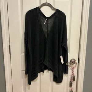 Free People sweater in washed black size small. Never worn. Has tags.